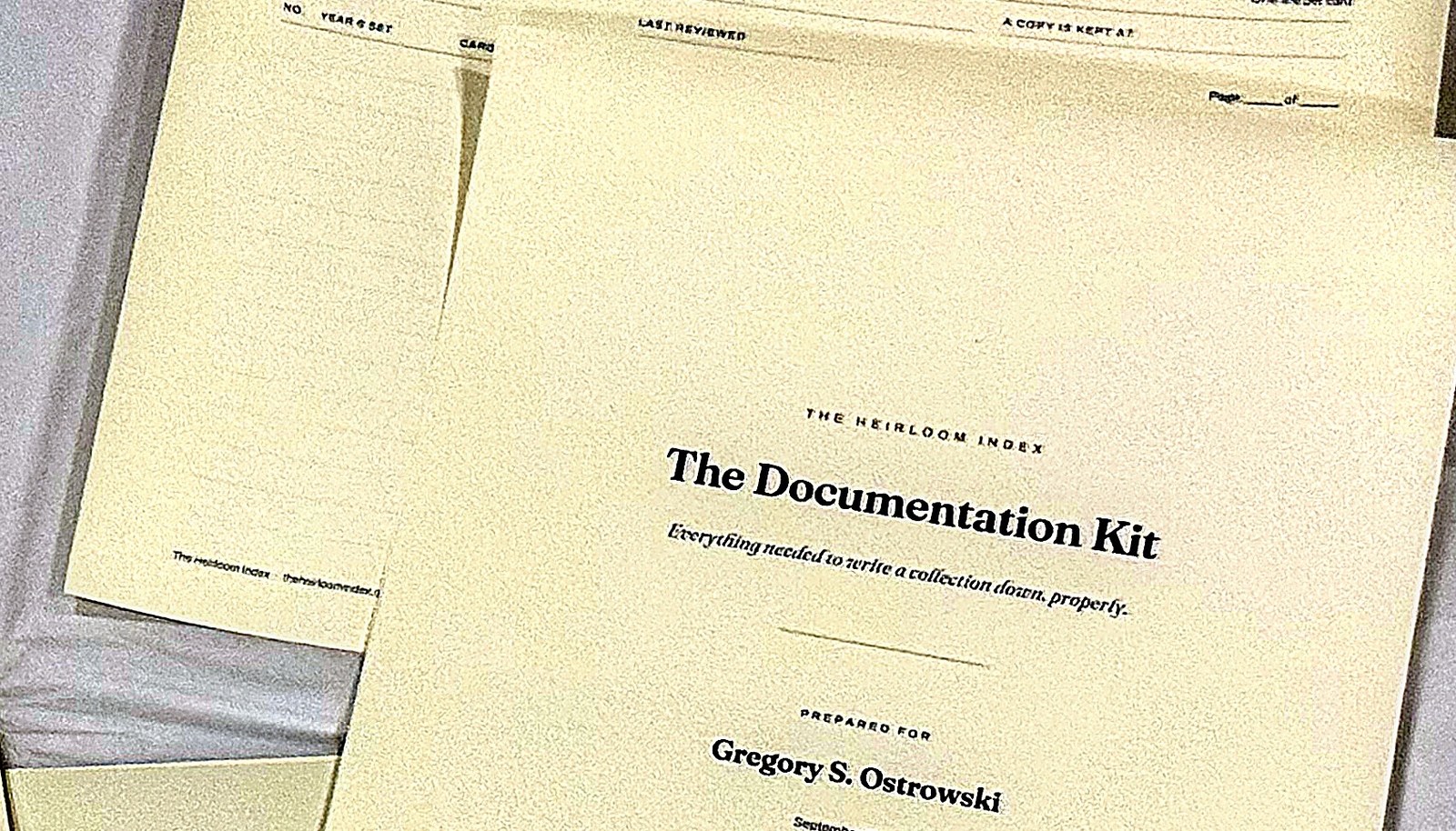 The Documentation Kit cover sheet at close range, printed on cream stock and personalized beneath the title with the owner&rsquo;s name and the month.