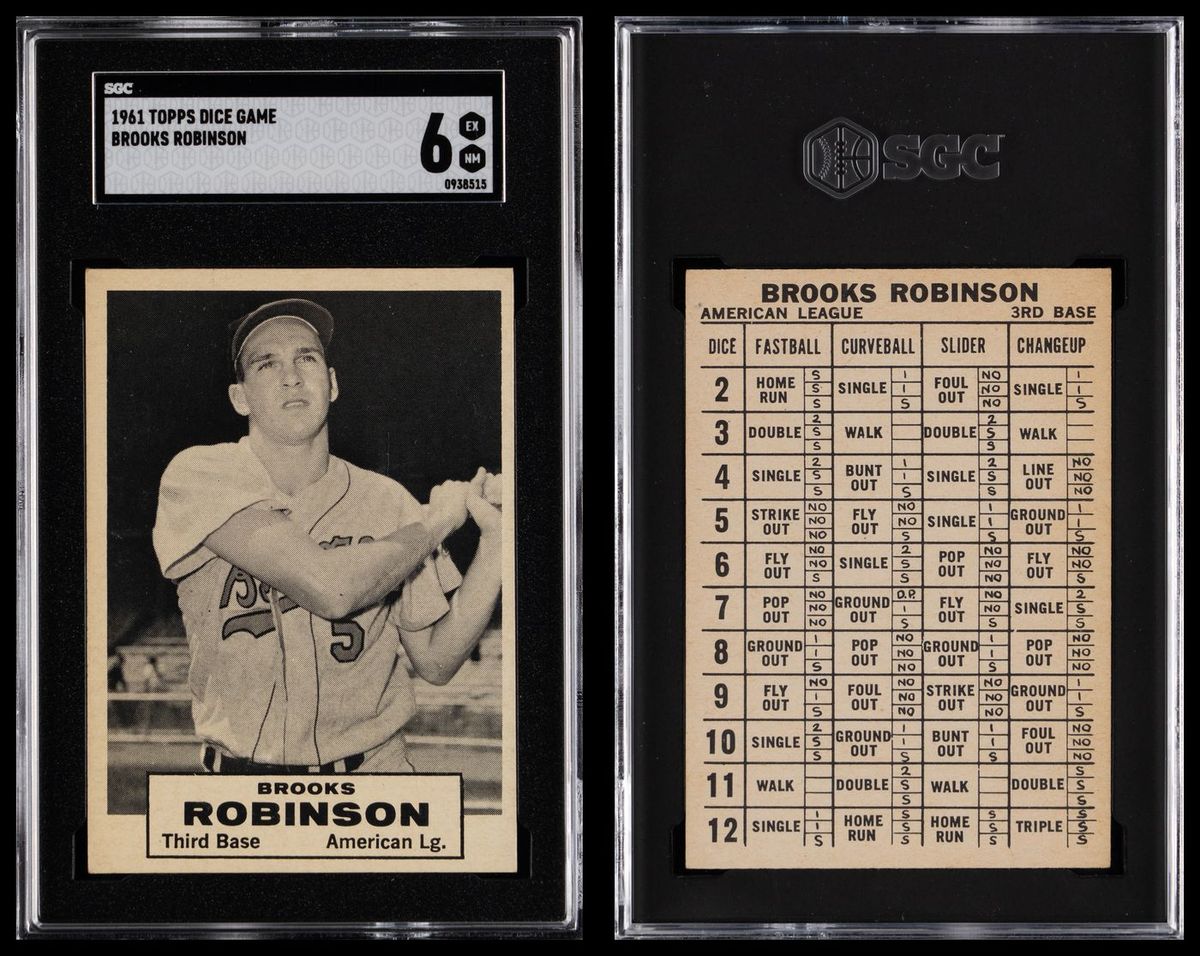 The 1961 Topps Dice Game Brooks Robinson card in an SGC holder, front and back — the front a black-and-white batting pose, the back a printed table of dice rolls against four kinds of pitch